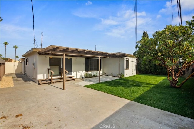 rear view of property featuring a patio area, a lawn, and a pergola