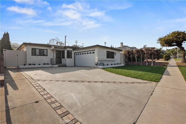 single story home featuring a front lawn and a garage