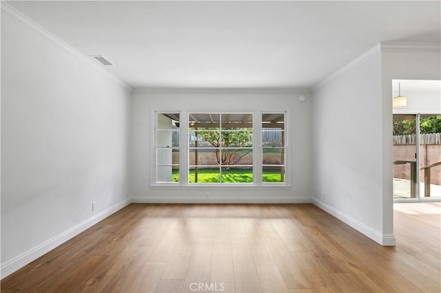 unfurnished room featuring crown molding