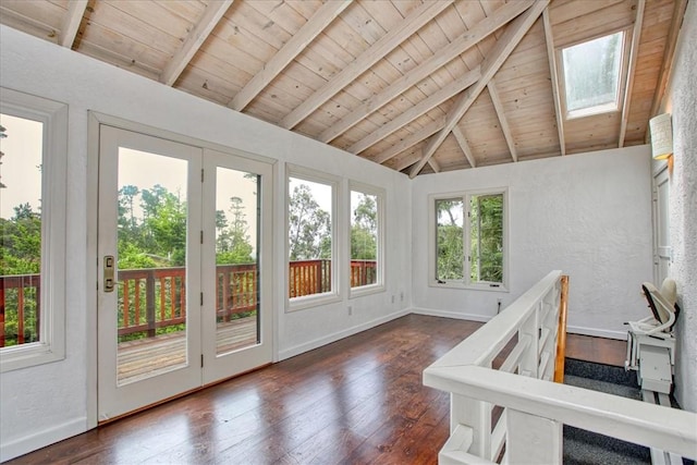 sunroom / solarium with lofted ceiling with skylight and wooden ceiling