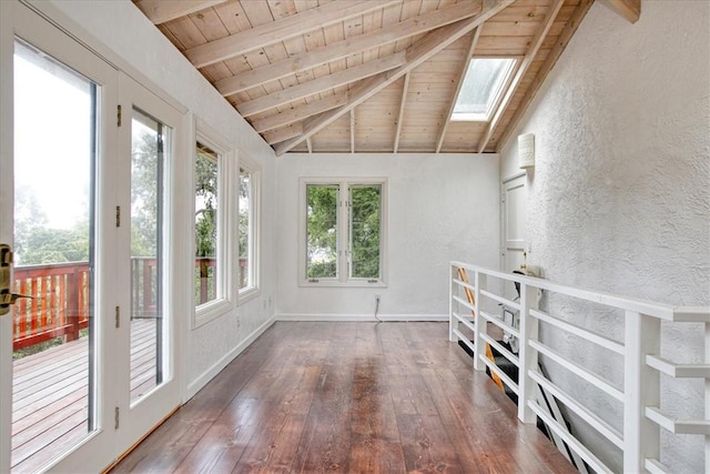 unfurnished sunroom with vaulted ceiling with skylight and wood ceiling