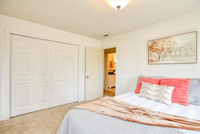 carpeted bedroom featuring a closet