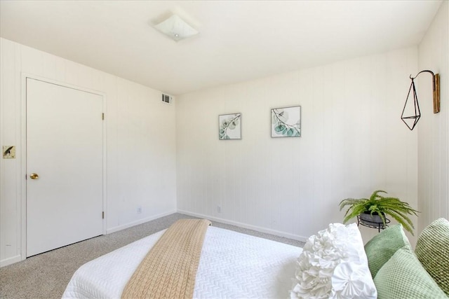 bedroom with light colored carpet