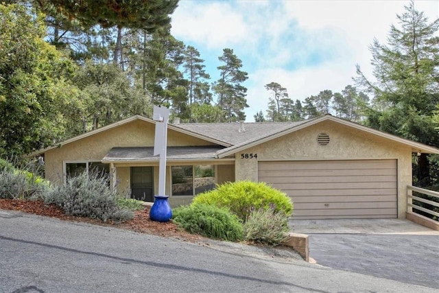 ranch-style home featuring a garage