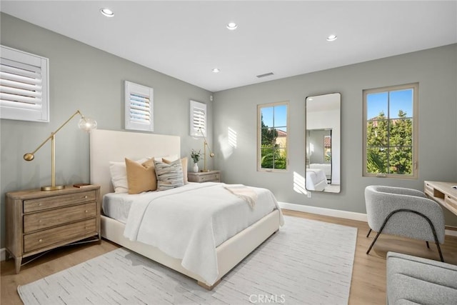 bedroom with light wood-type flooring