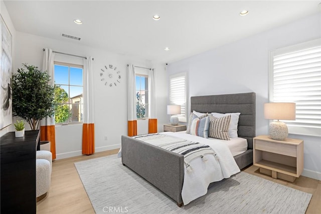 bedroom with light hardwood / wood-style floors