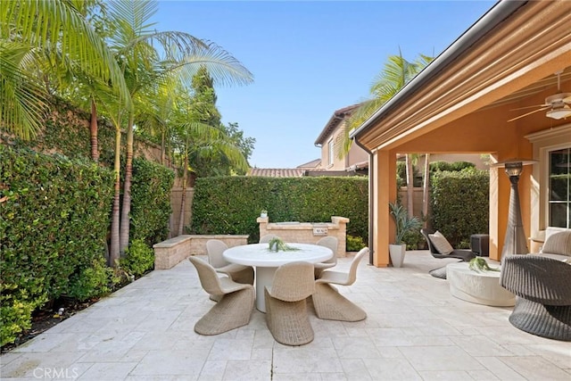 view of patio featuring ceiling fan