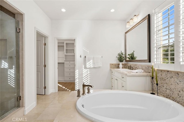 bathroom with vanity, separate shower and tub, and tile patterned flooring