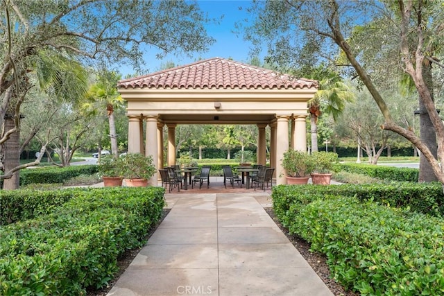 view of home's community with a gazebo and a patio