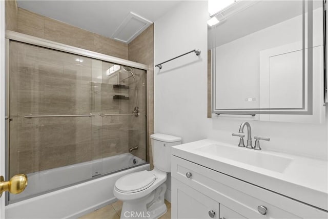 full bathroom with tile patterned floors, enclosed tub / shower combo, vanity, and toilet