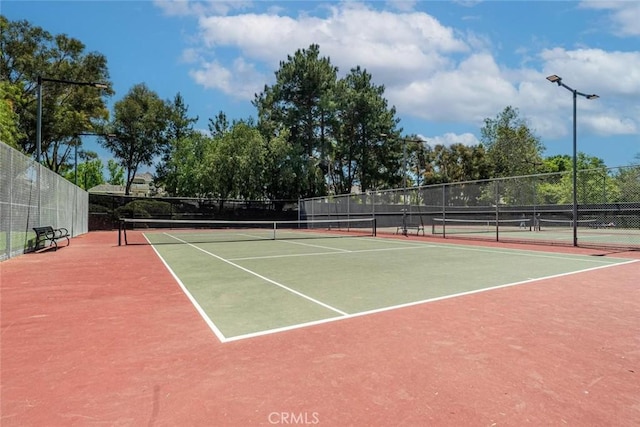 view of tennis court featuring basketball court