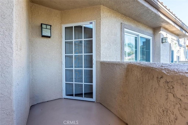 doorway to property featuring a balcony