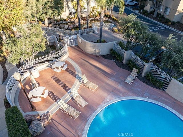 view of swimming pool with a patio area