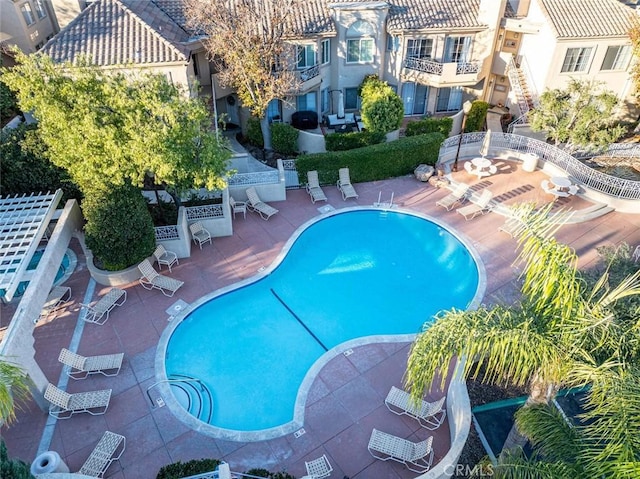 view of swimming pool featuring a patio area