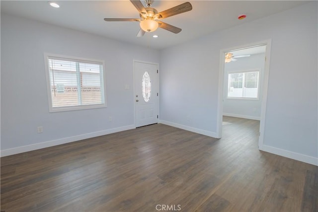 foyer featuring ceiling fan and dark wood-type flooring