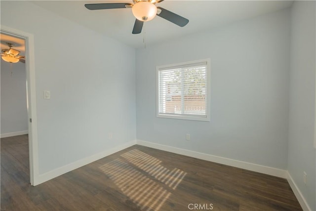 unfurnished room featuring ceiling fan and dark hardwood / wood-style floors