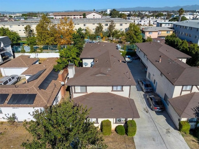 birds eye view of property featuring a mountain view