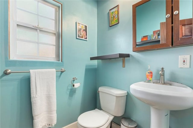 bathroom featuring sink and toilet