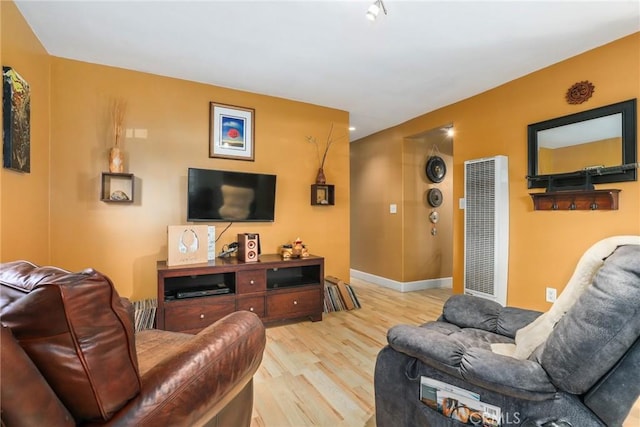 living room with light hardwood / wood-style flooring