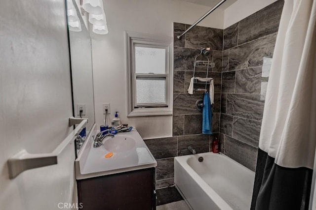 bathroom featuring vanity and shower / bathtub combination with curtain