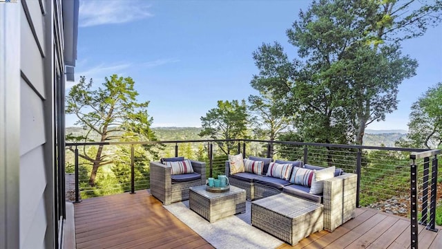 wooden terrace featuring outdoor lounge area