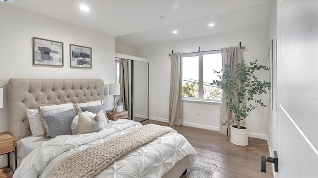 bedroom featuring dark hardwood / wood-style flooring