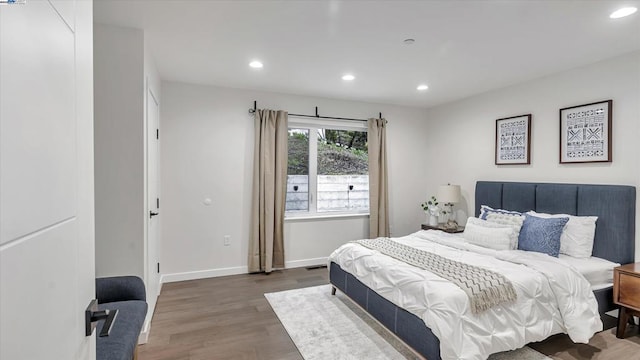 bedroom featuring dark wood-type flooring