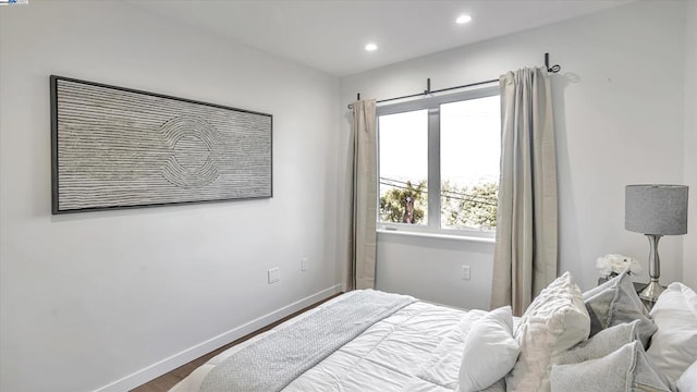 bedroom with wood-type flooring