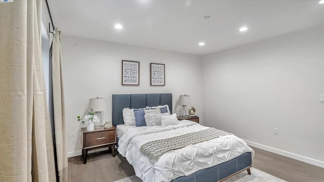 bedroom with hardwood / wood-style floors