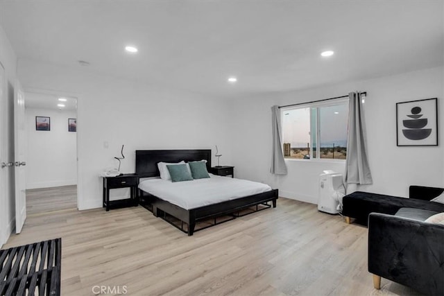 bedroom with light hardwood / wood-style floors