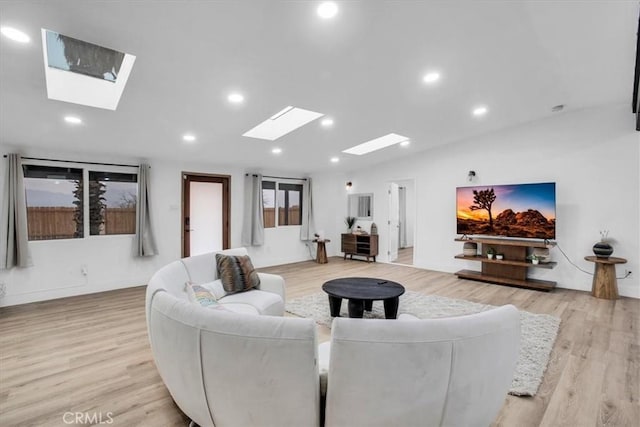 living room featuring light wood-type flooring and lofted ceiling