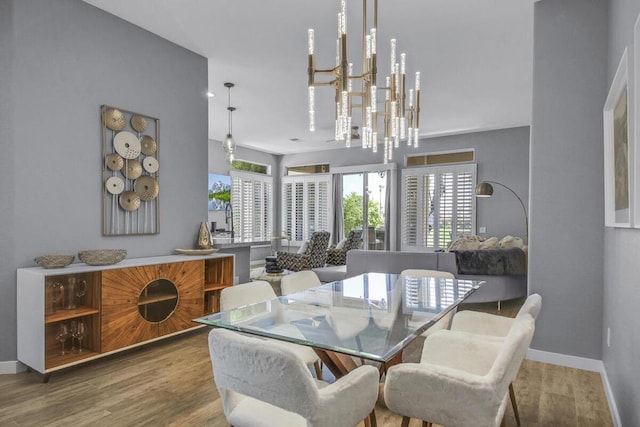 dining room with a notable chandelier and hardwood / wood-style floors