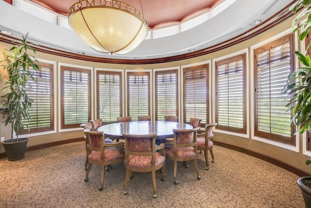 dining room featuring a wealth of natural light, ornamental molding, and a tray ceiling