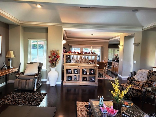 living room featuring dark hardwood / wood-style flooring and ornamental molding