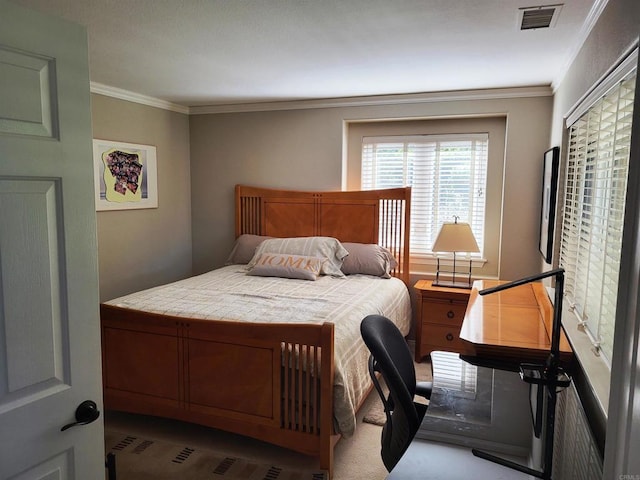 bedroom with crown molding