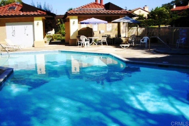 view of swimming pool featuring a patio area