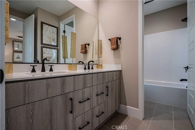 bathroom with tile patterned floors, tub / shower combination, and vanity