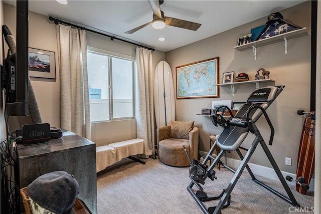 exercise room featuring ceiling fan and carpet floors