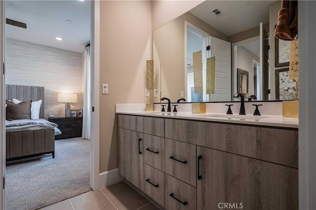 bathroom with tile patterned floors and vanity