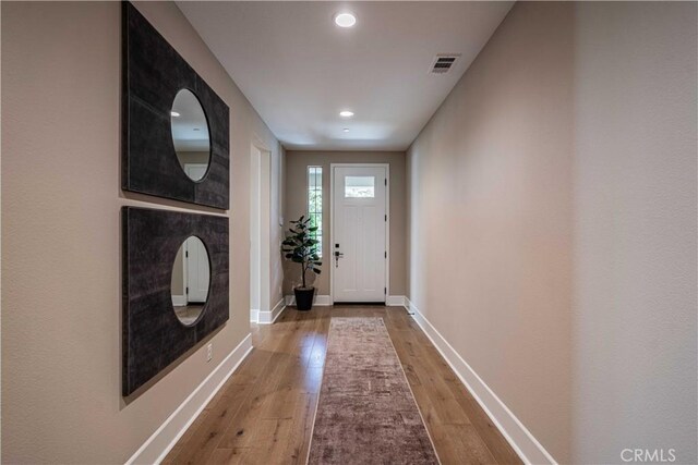 entryway with hardwood / wood-style flooring