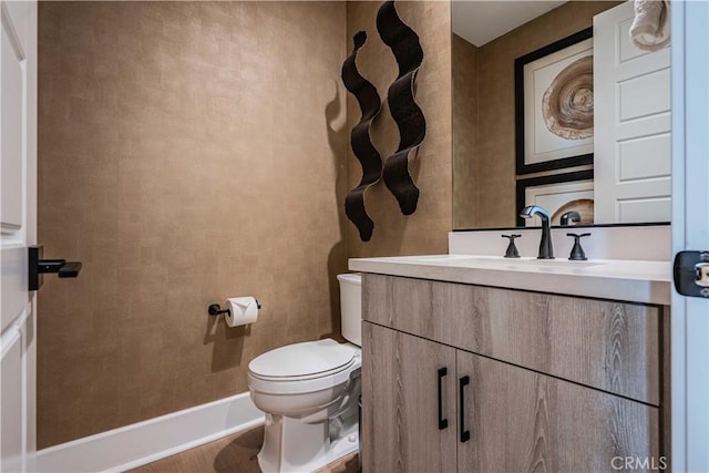 bathroom with toilet and vanity