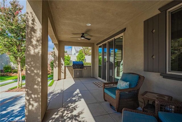 view of patio / terrace with ceiling fan and area for grilling