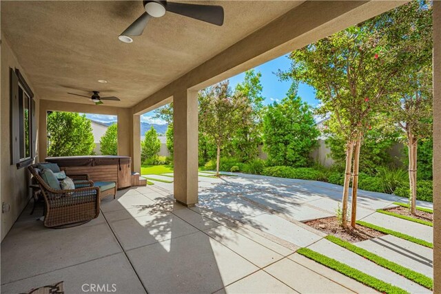 view of patio with a hot tub