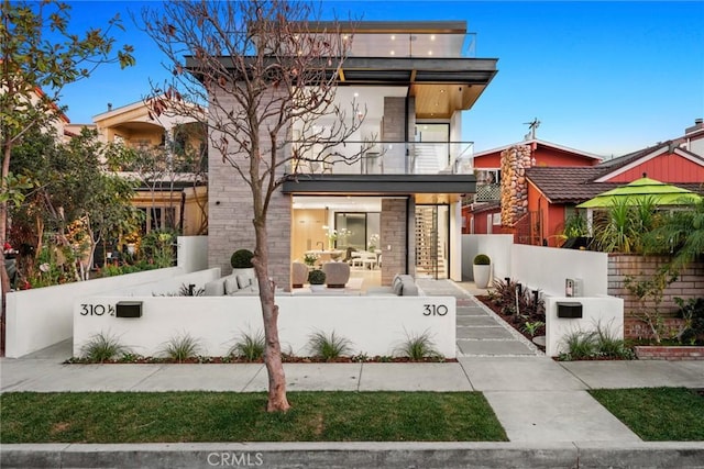 contemporary home with a balcony