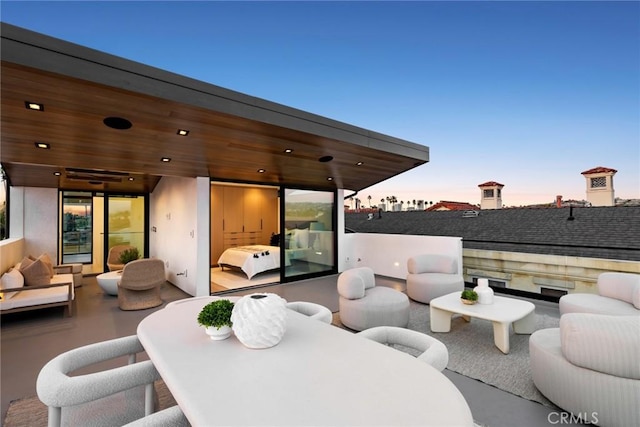 patio terrace at dusk with an outdoor hangout area