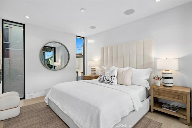 bedroom with light hardwood / wood-style floors