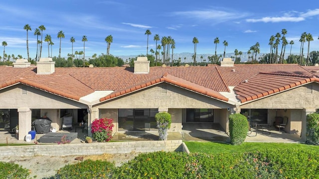 back of house with a patio area