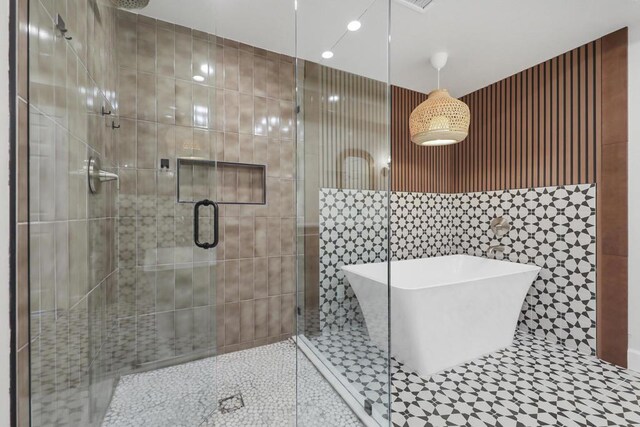 bathroom featuring separate shower and tub and tile patterned flooring