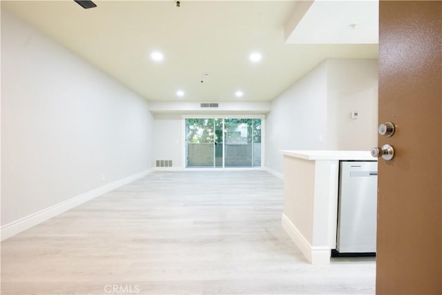 unfurnished living room with light wood-type flooring