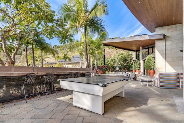 view of patio featuring an outdoor bar